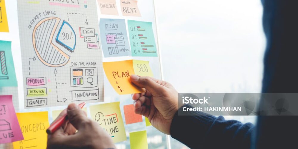 Sharing ideas concepts with papernote writing strategy on wall glass office.Business marketing and communication